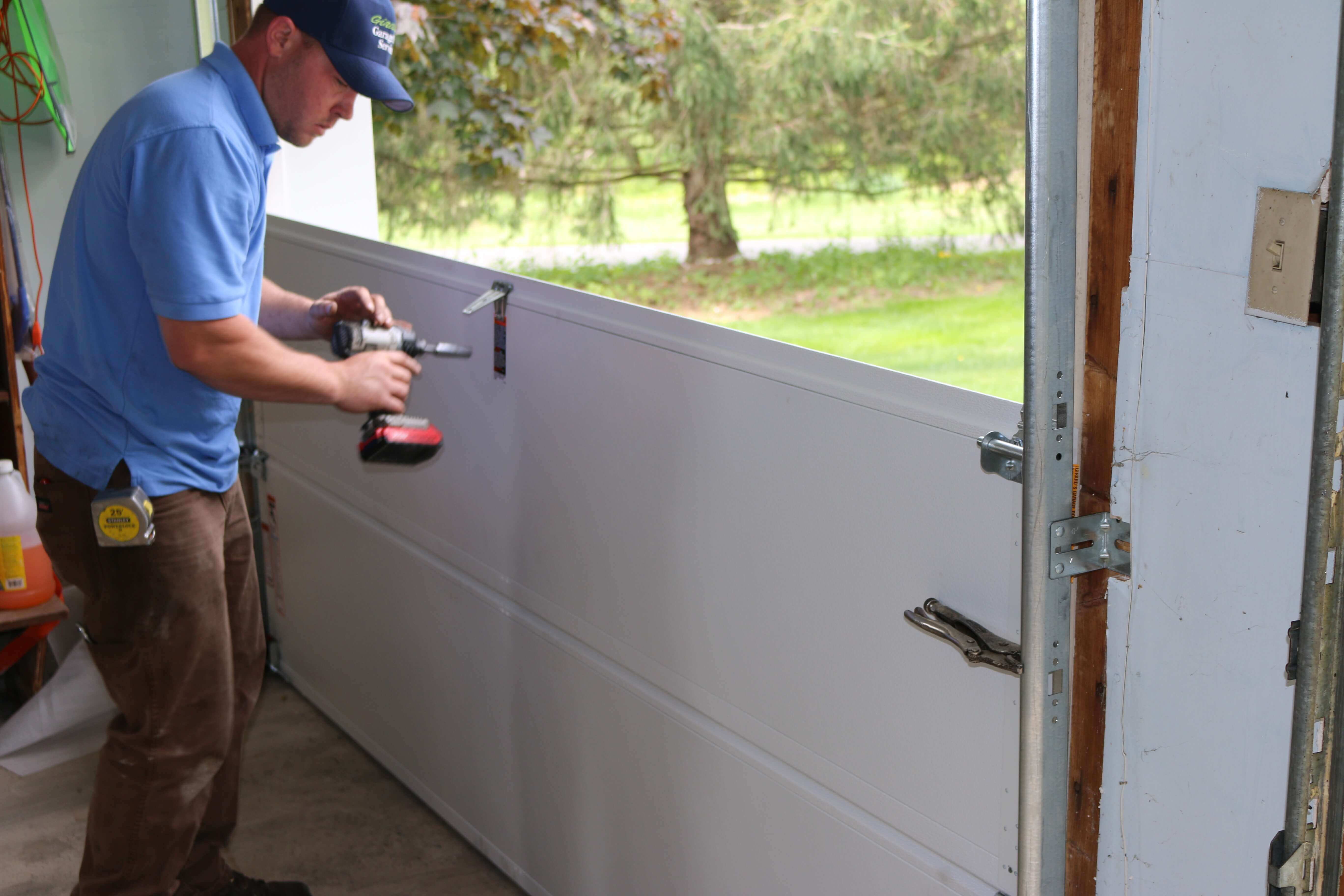 residential-garage-door-section-repair-lion-garage-door-virginia